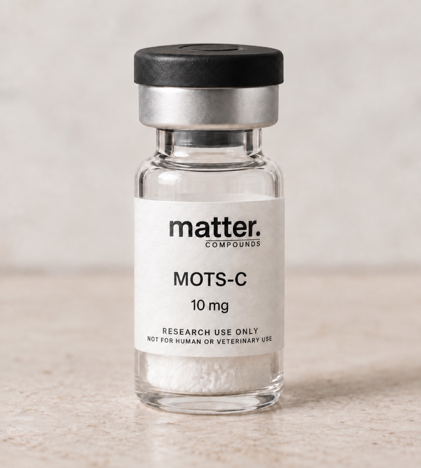 Clear 3 mL research vial with black flip-top closure and silver crimp seal, labeled matter. COMPOUNDS MOTS-C 10 mg, research use only