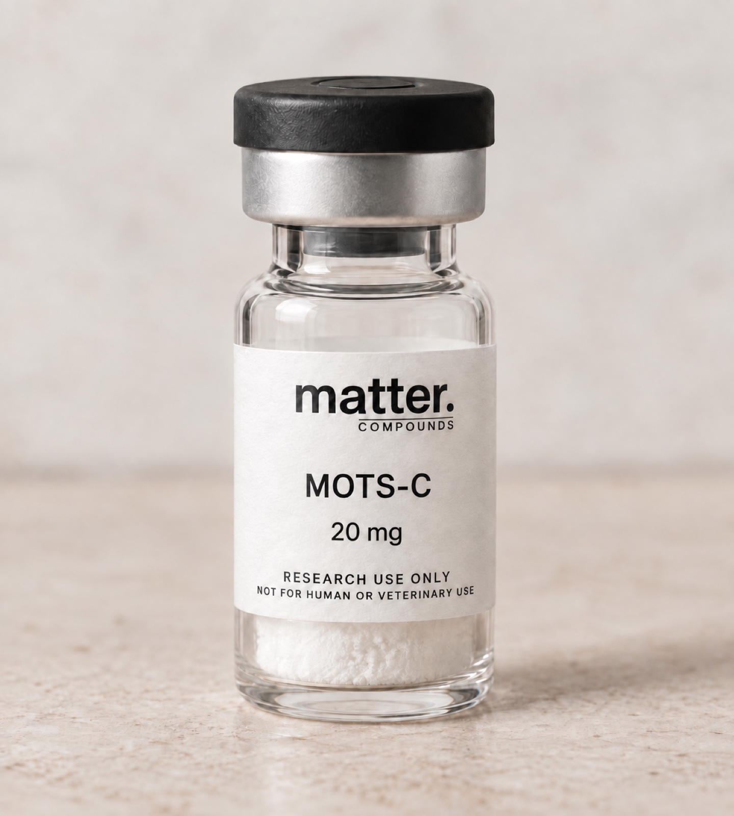 Clear 3 mL research vial with black flip-top closure and silver crimp seal, labeled matter. COMPOUNDS MOTS-C 20 mg, research use only